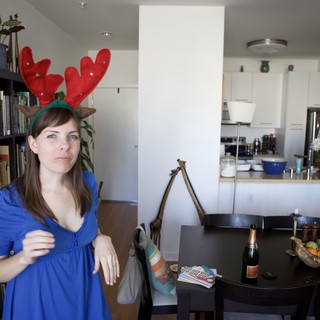 Unamused Woman in Reindeer Antlers on Christmas Day