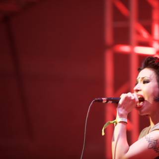 Bold Singer with Tattoos Rocking the Concert