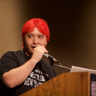 Red-Haired Speaker Addressing the Crowd