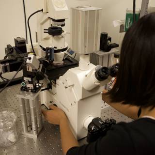 A Female Scientist's Studies Under the Microscope