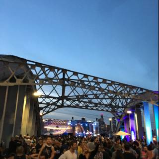Dusk Crowd Under the Bridge