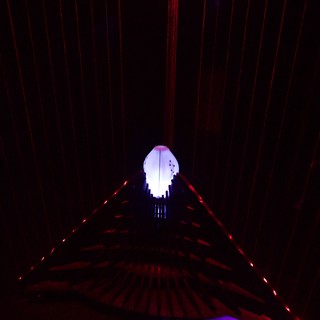 Illuminated Ghost Figure in Laser Light Installation