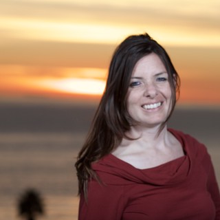 Radiant Smile at Golden Hour by the Sea