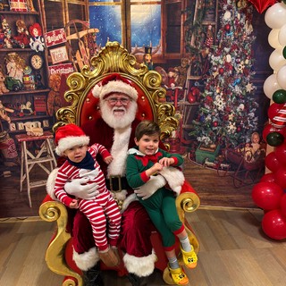 Santa's Workshop Visit with Two Happy Children