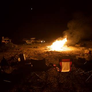 Nighttime Camping with Bonfire and Chairs
