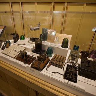 Vintage Telegraph Equipment and Insulators Display in Museum