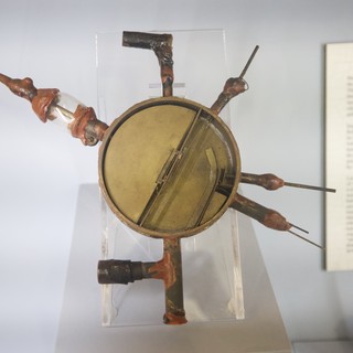 Ancient Surgical Tools Museum Display with Mirror