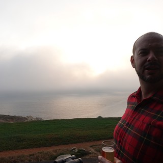 Sunset Beer by the Misty Coastline