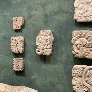 Ancient Emblems and Symbols on Stone Wall