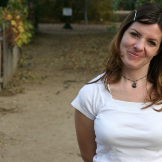 Smiling Woman on Autumn Garden Path