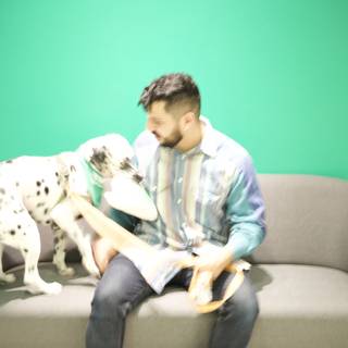 Man and Dalmatian Dog on the Couch