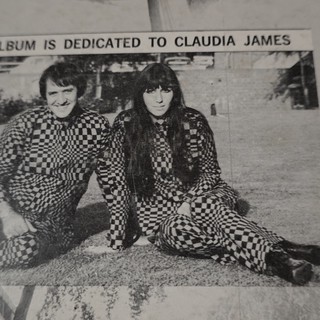 Duo in Matching Checkered Outfits Album Dedication