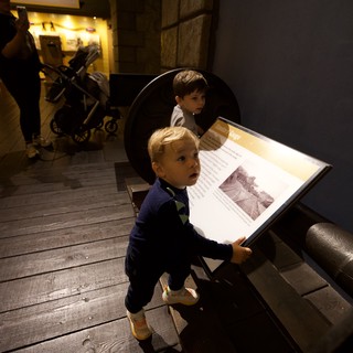 Young Boy Engaged in Museum Learning Experience