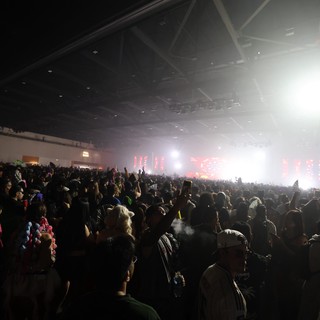 Massive Indoor Crowd Surges Toward Blazing Festival Stage