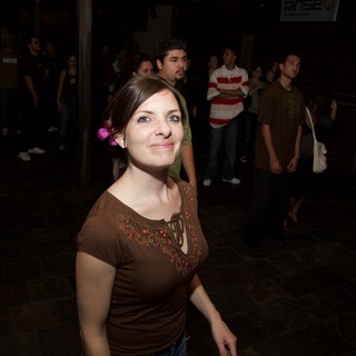 Young Woman Smiling at Night Outdoor Art Walk