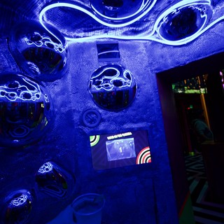 Immersive Blue UV Light Installation in Interactive Art Space