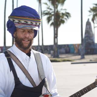Turbaned Musician Amidst Palm Trees