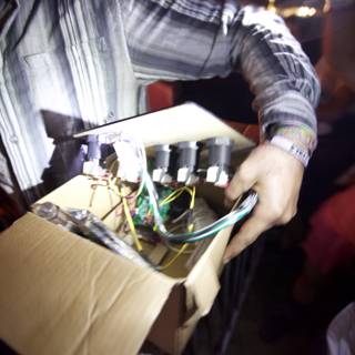 Man with a Box of Wires