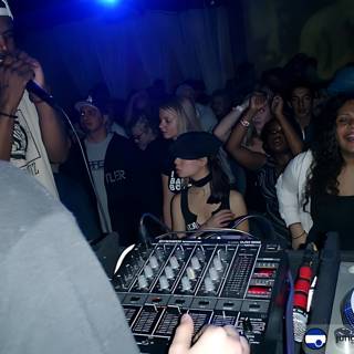 Nightclub DJ Entertaining Crowd with Music