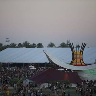 Concertgoers gather around large tent at Coachella Festival