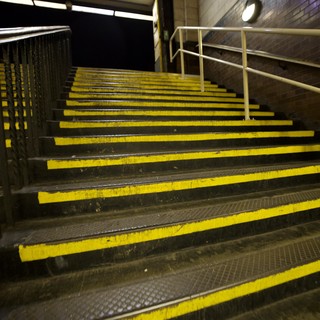 Yellow-Striped Industrial Stairs in London Underground Station