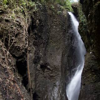 Stunning Waterfall Amidst Lush Greenery and Rocks