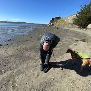Man and Dog Enjoying a Day at the Beach