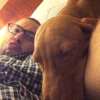 A Cozy Nap with Man's Best Friend