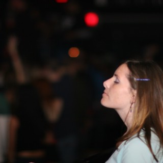 Young Woman Lost in Thought at Nightclub Event