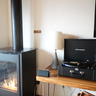 Cozy Living Room with Fireplace and Turntable