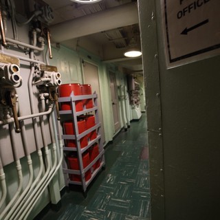 Naval Vessel Interior Corridor with Post Office Sign