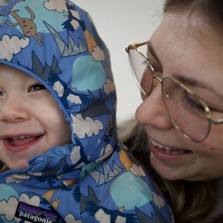 Joyful Winter Moment Between Mother and Child