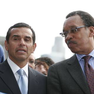 Two Men in Suits Stand Together