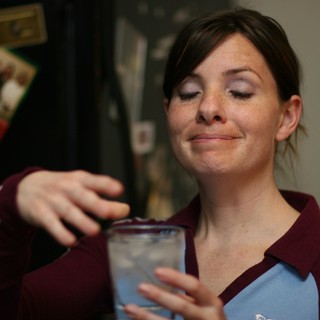 Woman Making a Face While Holding Drink