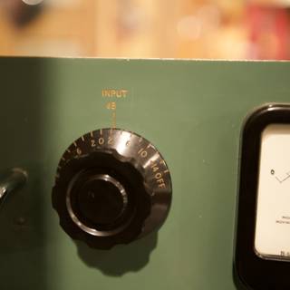 Gauging the Wheel: A Close-up of a Green Box's Meter