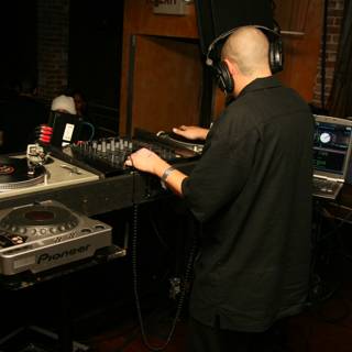 Black Shirt DJ Delivering a Music Extravaganza