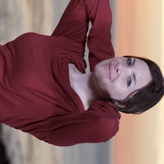 Woman in Crimson at Golden Hour Seaside