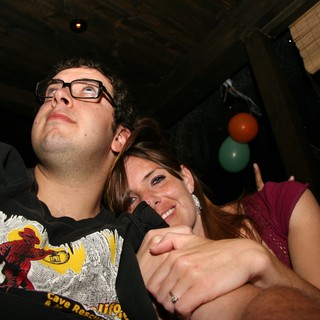 Couple Laughing Together at Late Night Party