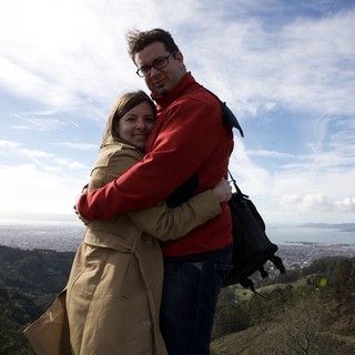Couple Embracing Atop Hill Overlooking San Francisco Bay