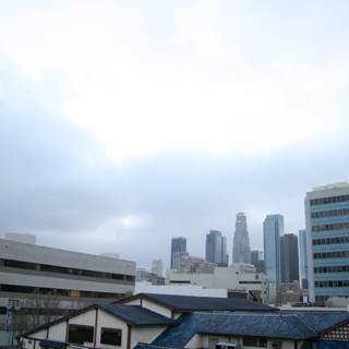 City Skyscrapers under a Cloudy Sky