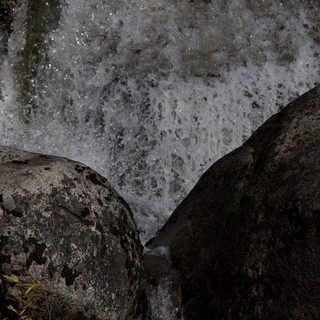 Rushing Water Between Ancient Granite Boulders in Yosemite