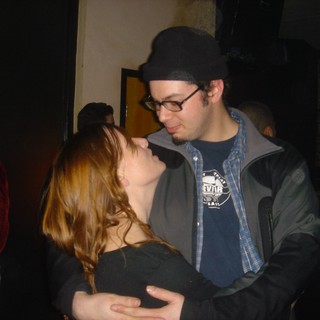 Intimate Couple Dancing at Dimly Lit Venue