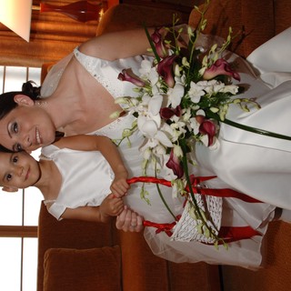 Bride and Flower Girl Share Tender Wedding Moment
