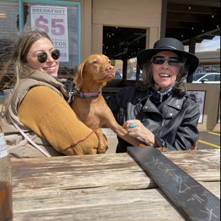 Two Women, a Dog, and Sunglasses