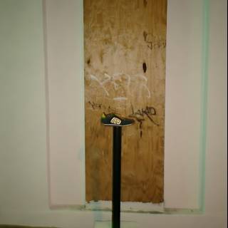 Graffiti on Wooden Door with White Pedestal