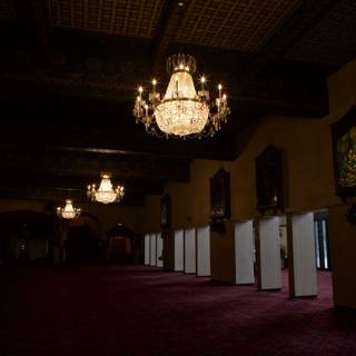 Grand Chandelier Illuminates Old Theater Lobby