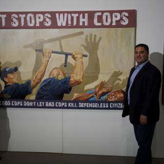 Obama and Uygur in front of Police Officer Painting