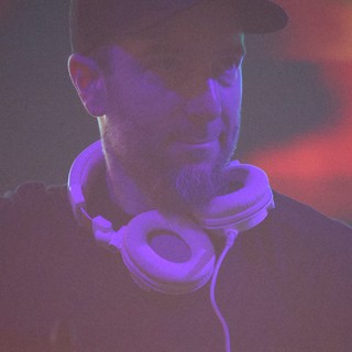 DJ Lost in Sound Under Purple Club Lights