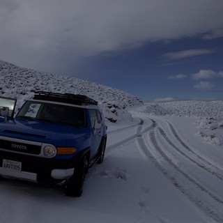 Blue Toyota FJ Cruiser on Snowy Mountain Road