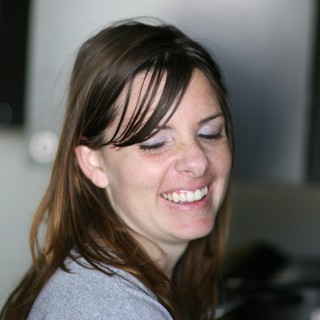 Joyful Woman Laughing in Casual Indoor Setting
